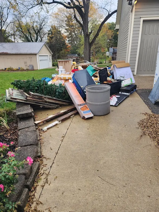 Dumpster being loaded with debris for 10 Yard Dumpster Rental in Hummelstown